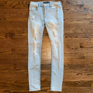 Light Wash Distressed Mid Rise Jeans